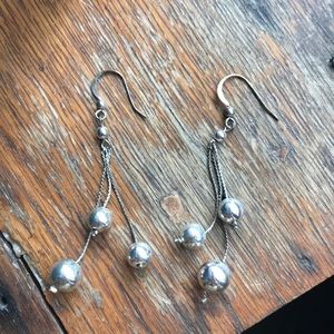 Silver dangling ball earrings